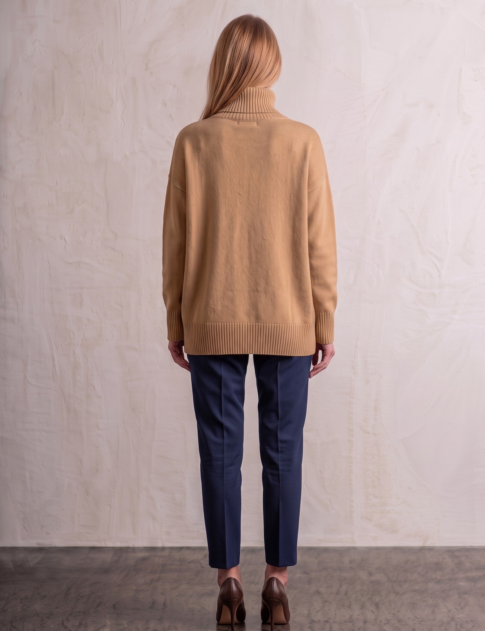 Women's Relaxed Fit Roll Neck Jumper in Camel, back view, full length.