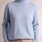 Women's Relaxed Fit Roll Neck Jumper in Light Blue, close-up of the upper body.