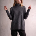 Women's Relaxed Fit Roll Neck Jumper in Dark Grey, front view, full length.