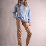 Women's Relaxed Fit Roll Neck Jumper in Light Blue, front view, full length.