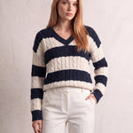 Women's Navy and Cream Striped Cable Knit V-Neck Jumper, three-quarter view from the left, full length.