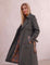 Deluxe Trench Coat, three-quarter view from the right, full length.