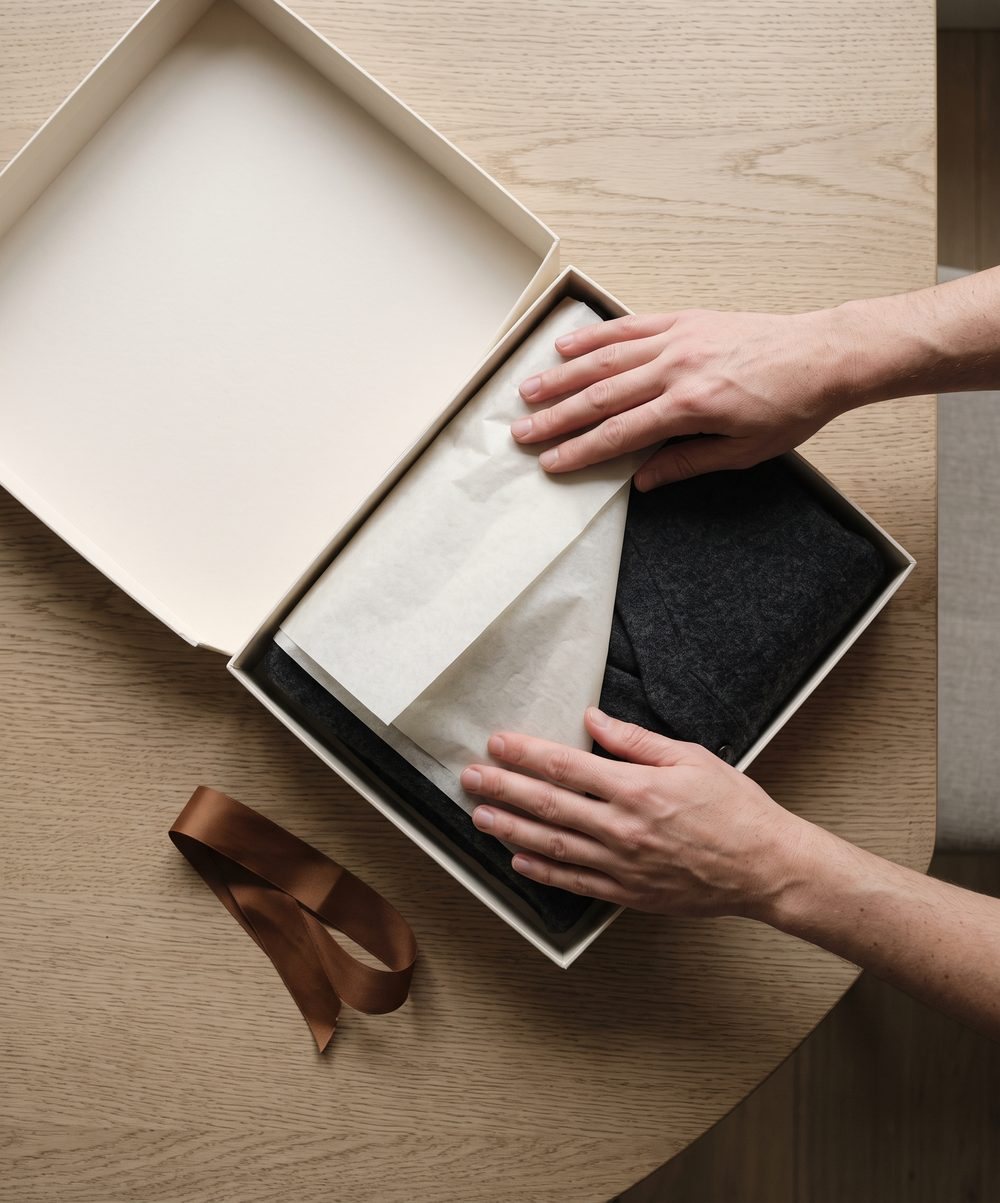 A Draycott order packed in tissue paper inside a card box